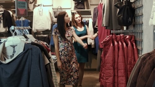 Young Women Shopping For Clothes at Retail Store