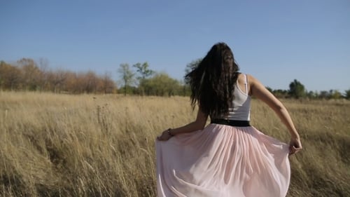 Young Beautiful Girl In The Field