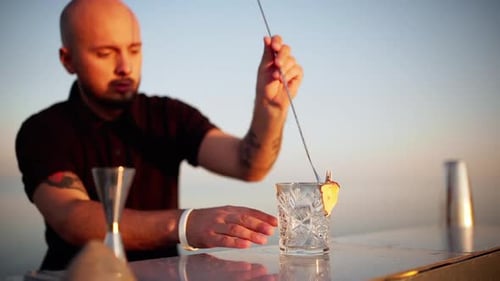 Bartender Making Cocktail Drink at Bar