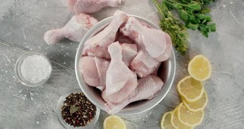 Overhead View of Raw Chicken Drumsticks and Ingredients