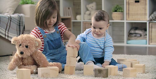 Children Playing with Blocks at Home