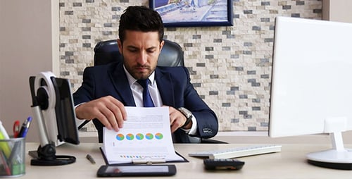 Man Works at Computer in Modern Office