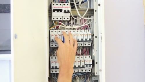 Person Opens and Closes Electrical Panel