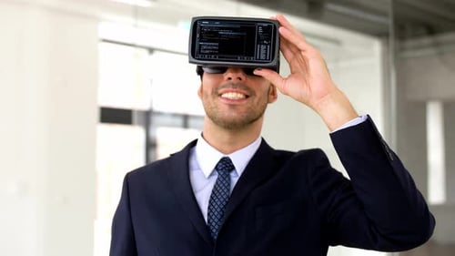 Enthusiastic Man Using VR Headset in Office
