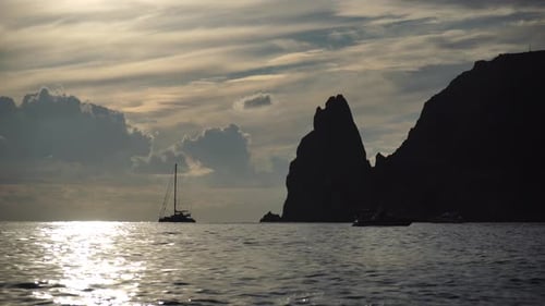 Sea Landscape with Rocky Coastline on Sunset Time