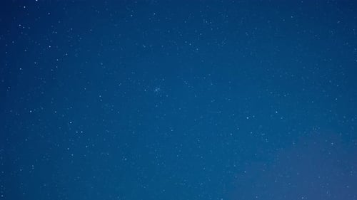 Twinkling Stars across a Deep Blue Night Sky