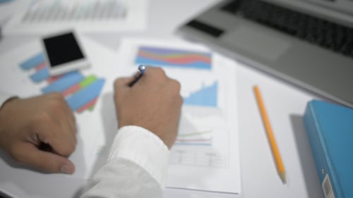 Man Checking Tax and Financial Documents