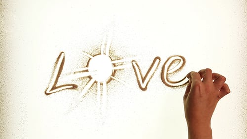 Word "Love" Drawn By Sand