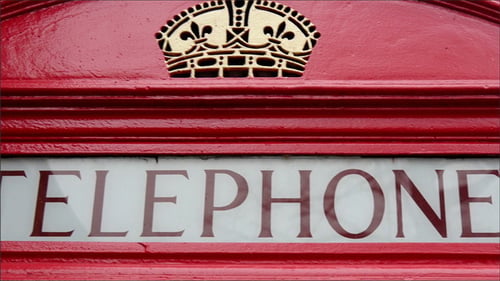A Red Telephone Booth Found on the Streetside