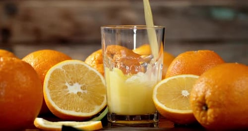 Orange Juice being Poured into a Glass