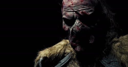 Scary Dark Fantasy Orc with Blood and Cuts on His Face,