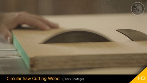 Table Saw Cutting Wood in a Bright Workshop
