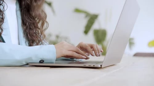 Close Up of Business Woman Hands Typing on Laptop Keyboard