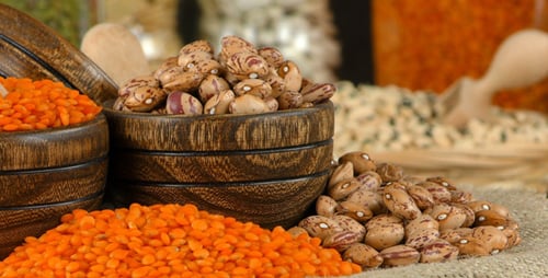 Colorful Lentils and Pinto Beans in Wooden Bowls