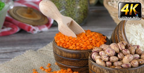 Dry Food Ingredients in Bowls with Wooden Scoop