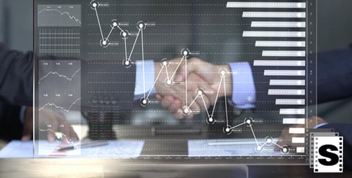 Businessmen Reviewing Charts on a Digital Transparent Screen