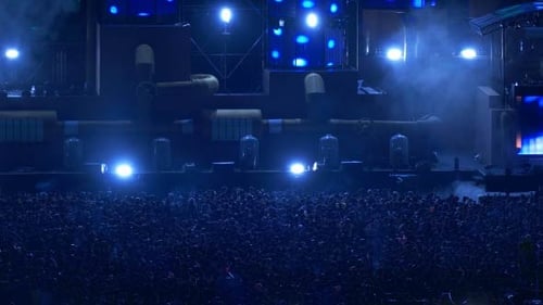Huge Crowd Enjoys Concert with Colorful Stage Lighting