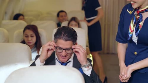 Man Receives Pillow on Airplane for Comfortable Flight