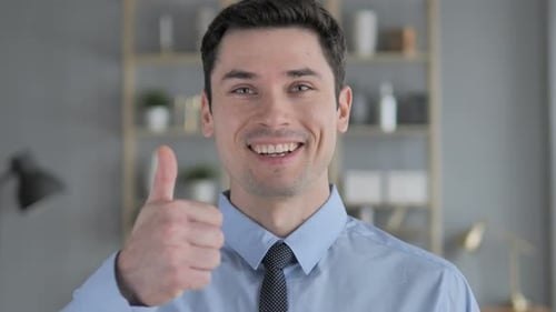 Man Smiling and Giving Thumbs Up Close Up