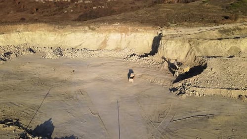 Aerial View of Open Pit Mining Site of Limestone Materials for Construction Industry with Excavators