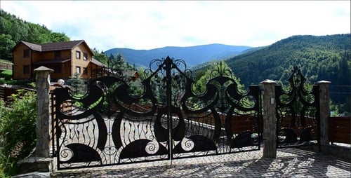 Ornate Gate and Mountain Landscape View