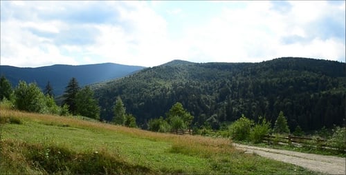 Scenic Mountain Vista with Rolling Green Hills