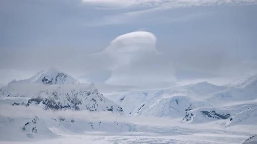 Clouds Float Above Snow Mountain Ranges Timelapse. Amazing Antarctic Winter Nature Landscape