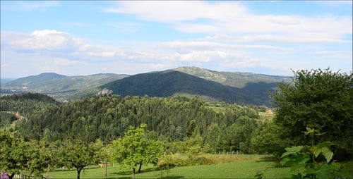 Scenic Mountain Landscape with Rolling Green Hills