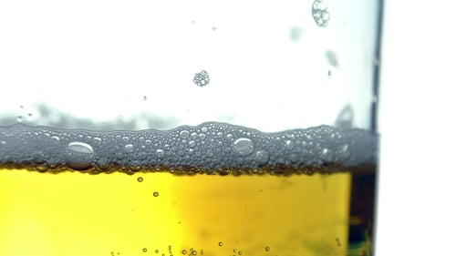 Close Up of Bubbles in Glass of Beer
