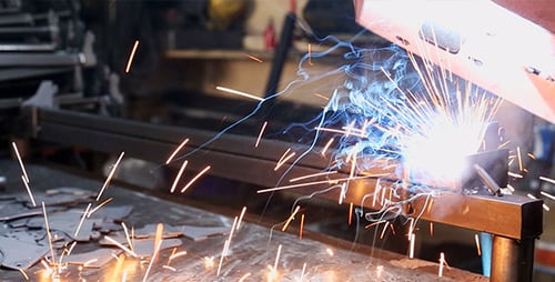 Metal Construction with Welding Sparks in Factory