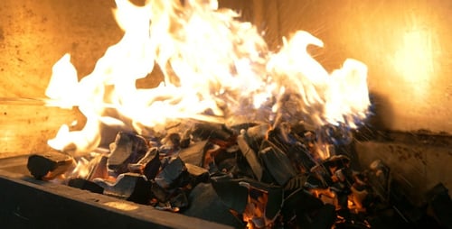 Burning Charcoal with Orange and Blue Flames