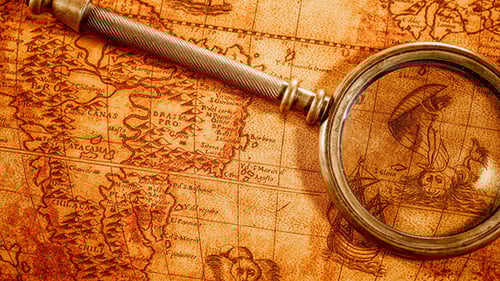 Magnifying Glass Reveals Vintage World Map Detail