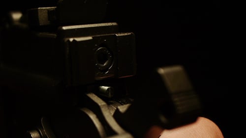 Close-up of Black Firearm in Low Lighting