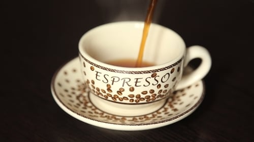 Espresso Being Poured into Cup in Close-up