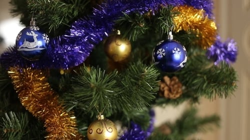Festive Christmas Tree with Gold and Blue Ornaments
