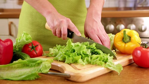 Chopping Fresh Vegetables in a Home Kitchen