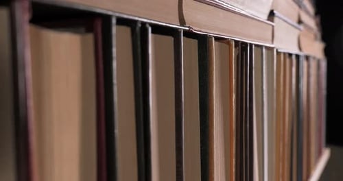 Close Up of Worn Books on Shelf