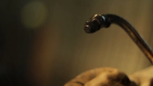 Igniting Metal Torch Flame with Gloved Hand