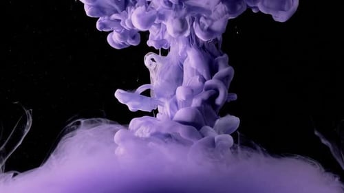 Purple Ink Flowing in Water on Black Background