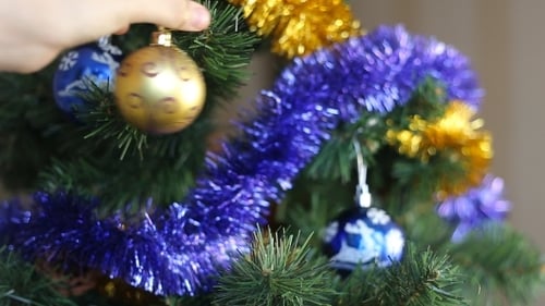 Decorating Christmas Tree with Festive Ornaments