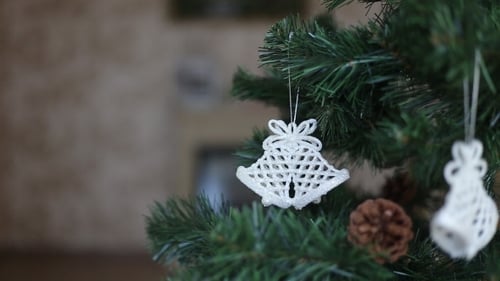 Christmas Tree Adorned with Delicate White Ornaments