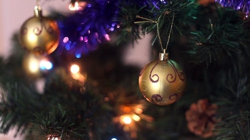 Festive Christmas Tree with Gold Ornaments and Lights