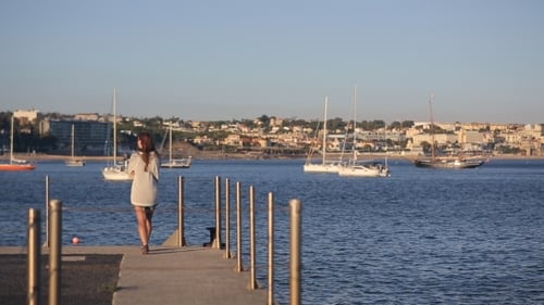 Girl Walking At The Evening On Marina Pier