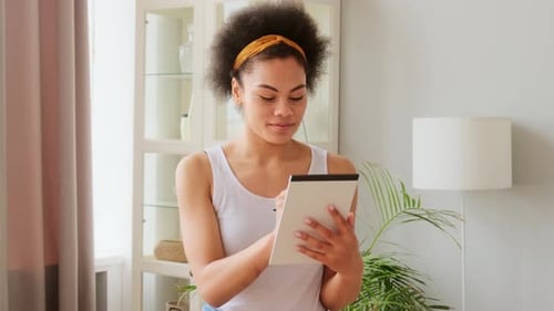 Woman Using Tablet and Pencil at Home