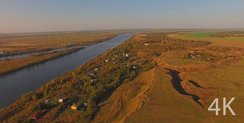 Small village by the river at dawn
