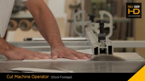 Man Using Table Saw to Cut Material