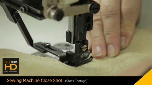 Sewing Machine Stitching Light Brown Fabric Close Up