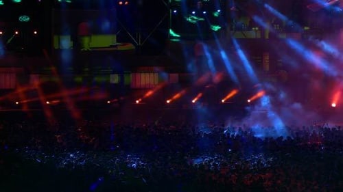 Huge Concert Crowd Lit by Colorful Stage Lights