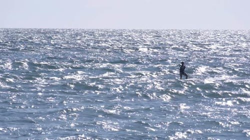 Stand-up Paddle Boarding on Ocean in the Sunshine