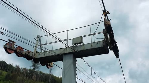 A Look at the Support of the Ski Lift and the Movement of the Cable Car. View From the Tourist's